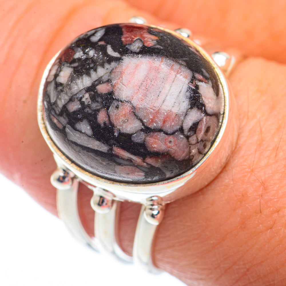 Sterling silver oval fossil ring with red-gray crinoid cabochon and open shank