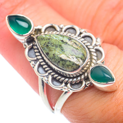 Sterling silver ring with speckled green oval center and two green teardrop stones