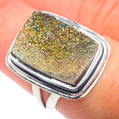 Sterling silver rectangular drusy pyrite ring, hand-held close-up of gold sparkle surface