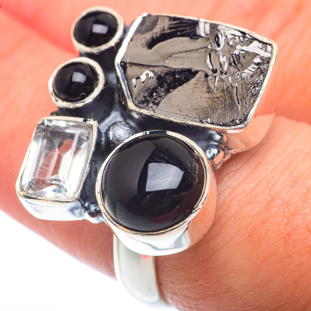 Sterling silver ring showing four stones: black onyx and clear square diamond