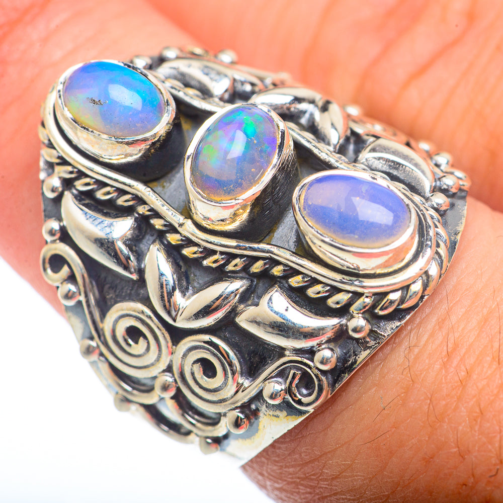Sterling silver opal ring with three oval opal cabochons and engraved side details