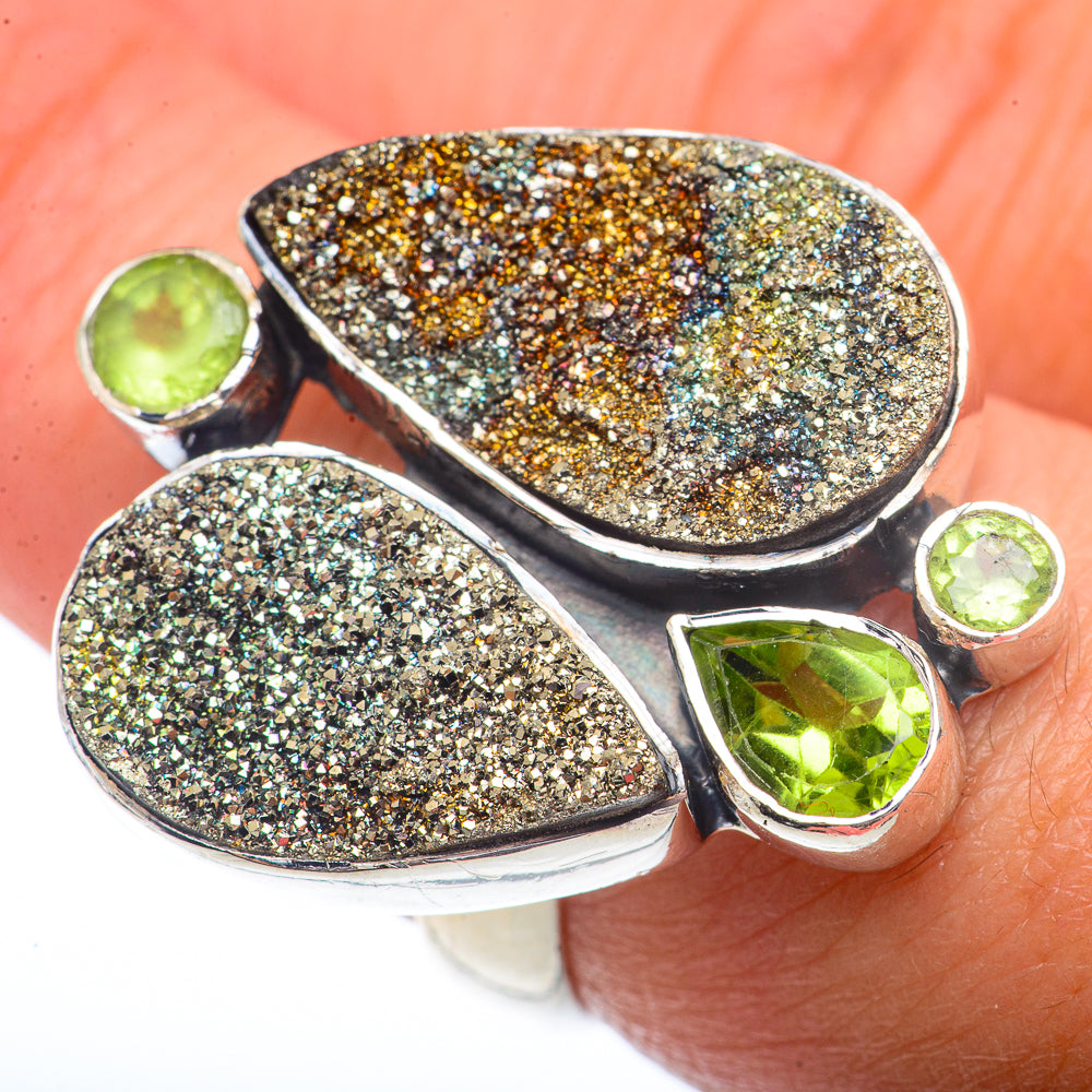 Sterling silver ring with druzy pyrite teardrop panels and three green peridot stones