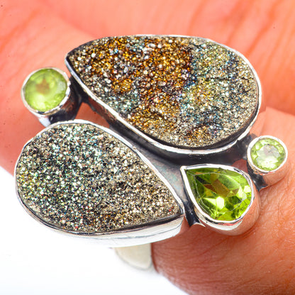 Sterling silver ring with druzy pyrite teardrop panels and three green peridot stones