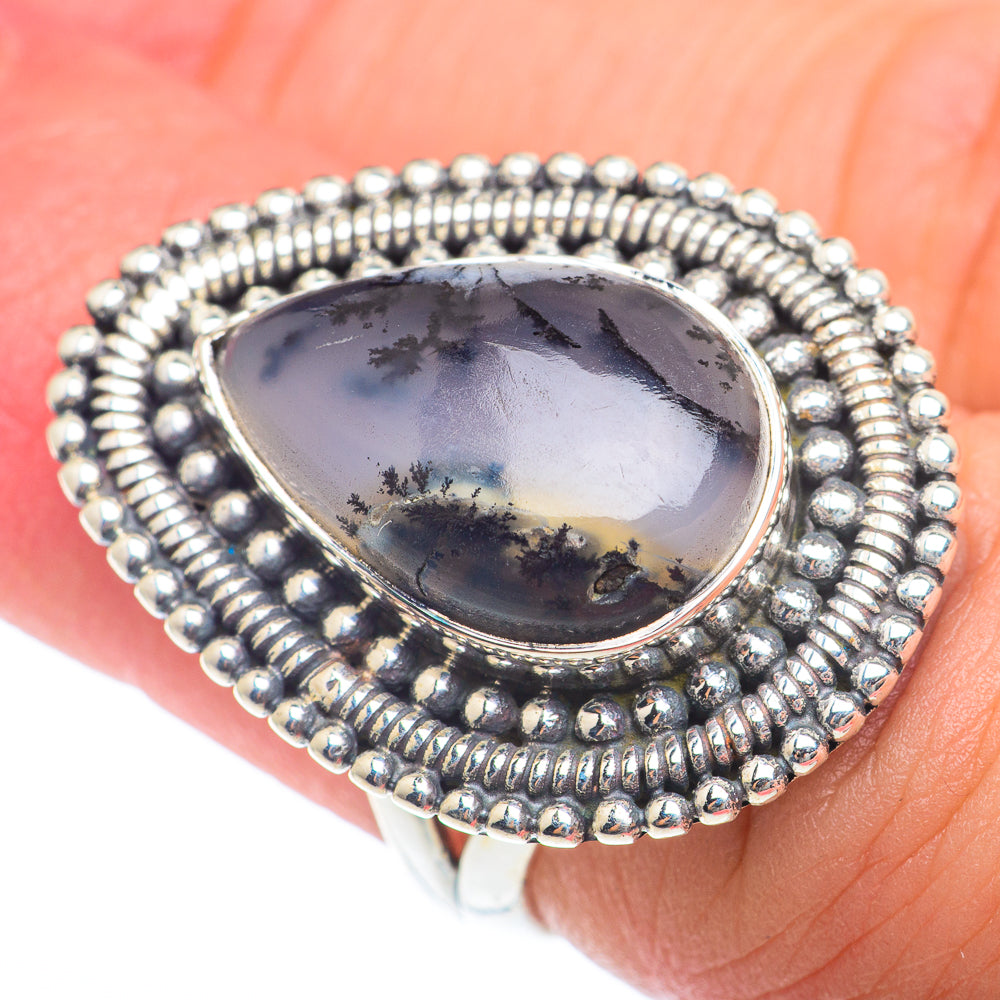 Oval dendritic opal ring in 925 sterling silver with textured bead halo and bezel