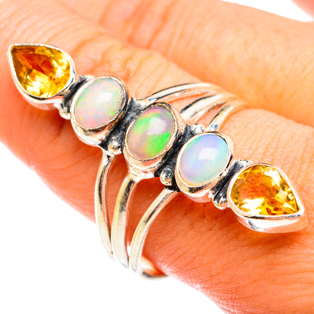 Sterling silver ring with three opal cabochons and two yellow citrine teardrops