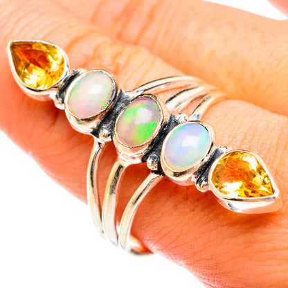 Sterling silver ring with three opal cabochons and two yellow citrine teardrops