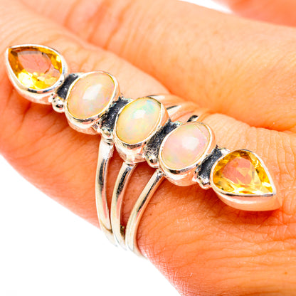 Sterling silver opal and citrine ring with multiple oval opal stones and side citrines