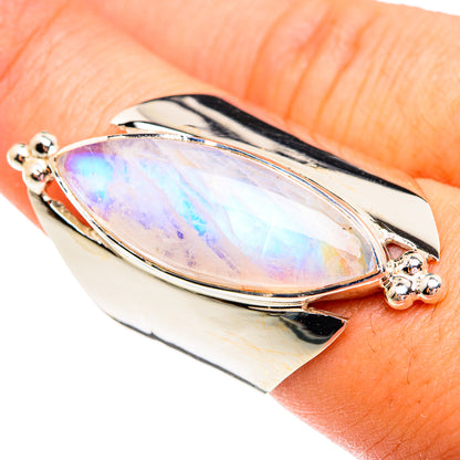 Sterling silver ring with oval rainbow moonstone cabochon and prong accents