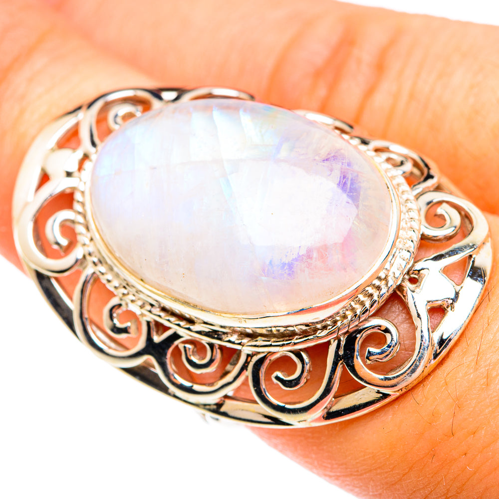 Moonstone oval sterling silver ring with scroll filigree and iridescent white stone