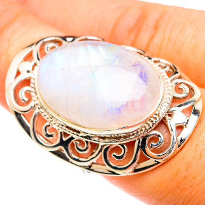 Moonstone oval sterling silver ring with scroll filigree and iridescent white stone