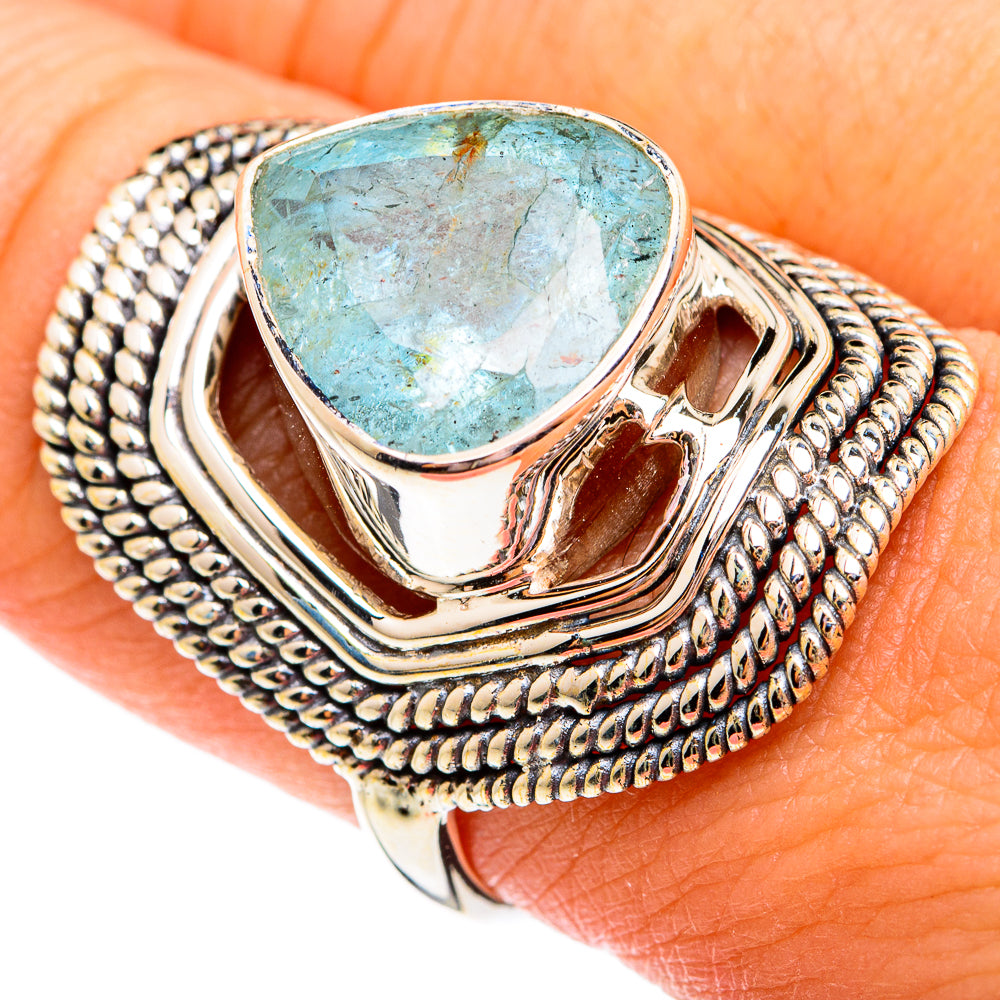 Sterling silver ring with rough aquamarine teardrop stone and textured rope border