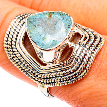 Sterling silver ring with rough aquamarine teardrop stone and textured rope border