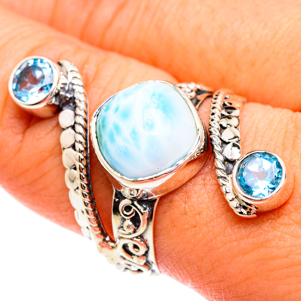 Sterling silver ring with oval blue larimar stone, rope setting, and round blue topaz