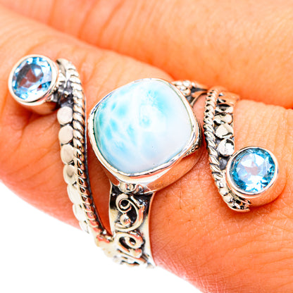 Sterling silver ring with oval blue larimar stone, rope setting, and round blue topaz