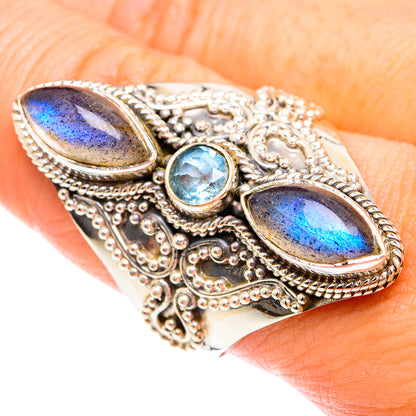 Sterling silver ring with two oval labradorite stones and round blue topaz, detailed filigree