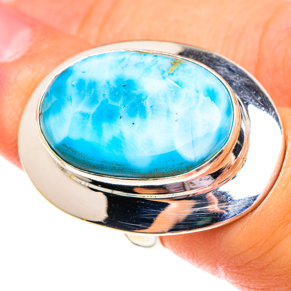 Sterling silver ring with oval turquoise-blue larimar gemstone, polished bezel setting