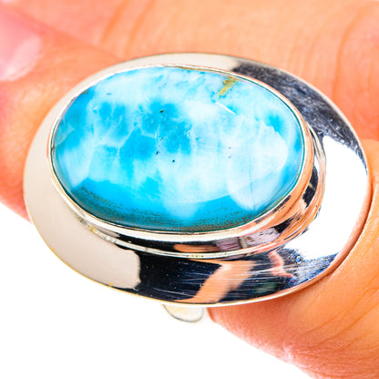 Sterling silver ring with oval turquoise-blue larimar gemstone, polished bezel setting