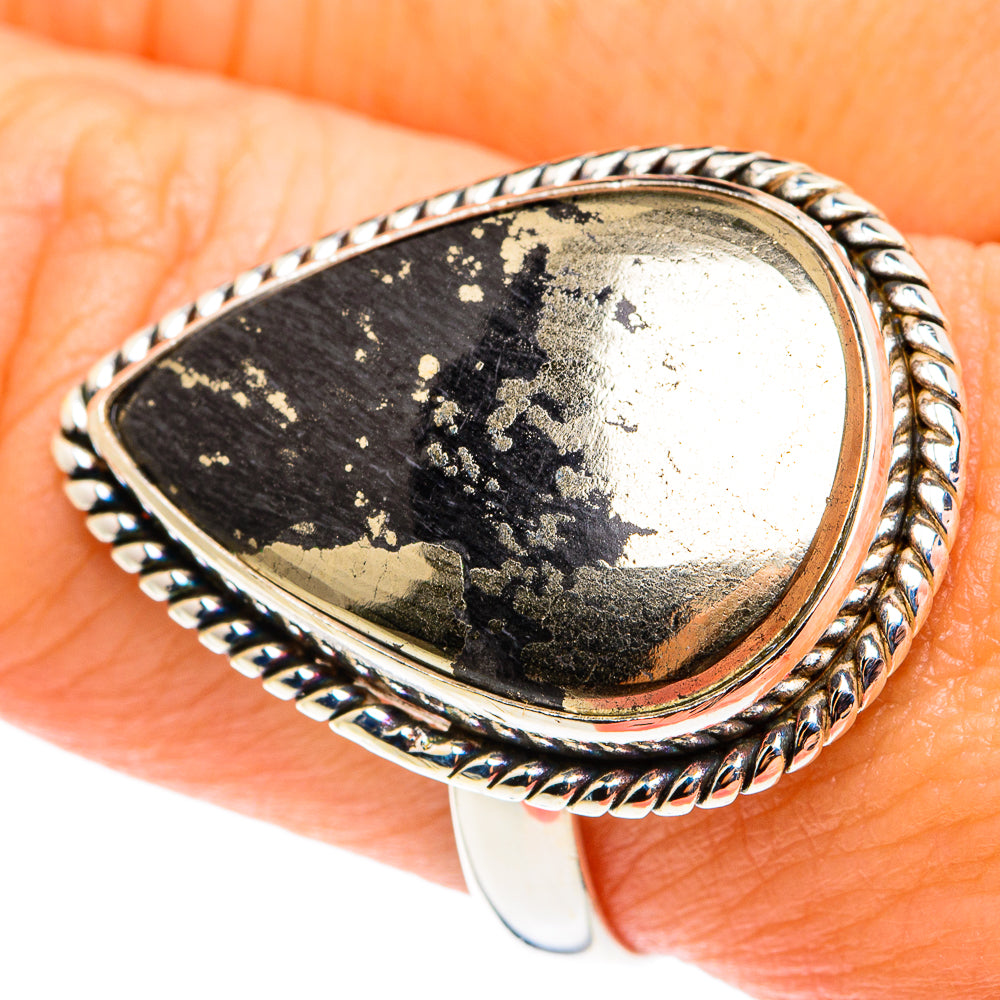 Teardrop black onyx cabochon ring with gold-speckled face, braided silver bezel