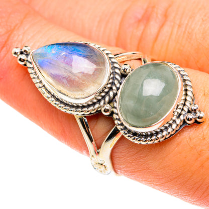 Sterling silver two-stone ring with teardrop rainbow moonstone and green gemstone accents