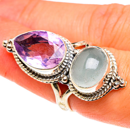 Sterling silver ring with large oval faceted amethyst and oval aquamarine cabochon