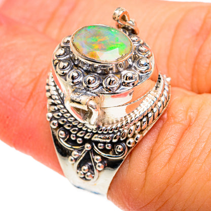 Sterling silver ring with oval green opal and raised bead-and-scroll filigree border