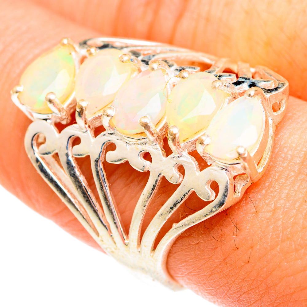 Sterling silver opal ring with faceted oval Ethiopian opal and filigree cutout band