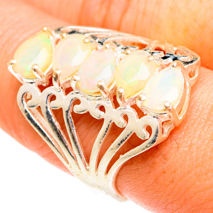 Sterling silver opal ring with faceted oval Ethiopian opal and filigree cutout band