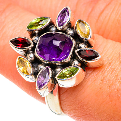 Amethyst gemstone ring with oval purple center and multicolor side stones, silver setting