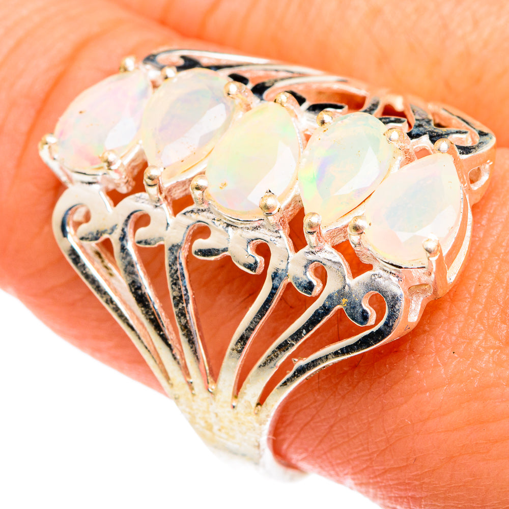 Opal ring showing filigree openwork and three oval faceted stones