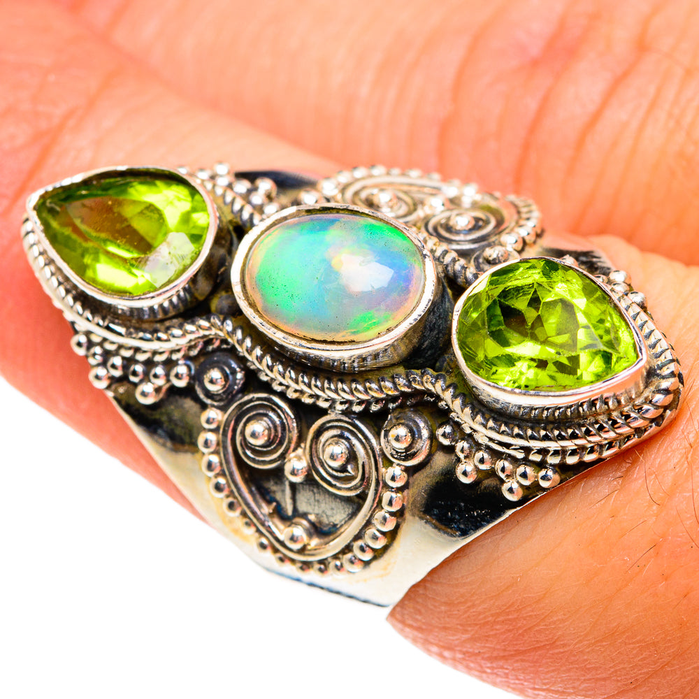 Sterling silver ornate ring with round green peridot stones and oval opal cabochon