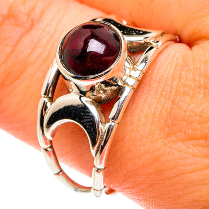 Garnet oval bezel sterling silver ring with marbled prong design, size 10.75