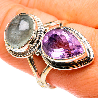 Faceted amethyst and oval aquamarine ring in silver with decorative textured borders