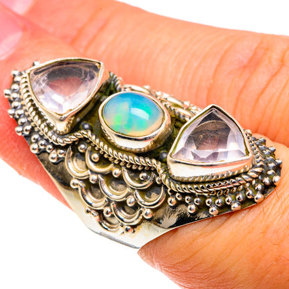 Ornate sterling silver ring with two triangle stones and blue-green oval opal top view