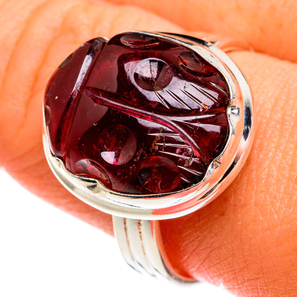 Sterling silver garnet ring with oval red gemstone and polished band
