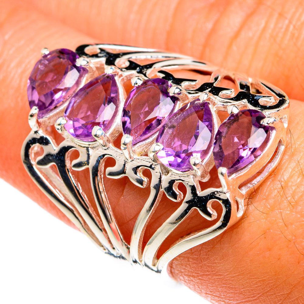 Amethyst ring in 925 sterling silver with four faceted oval purple gemstones on side