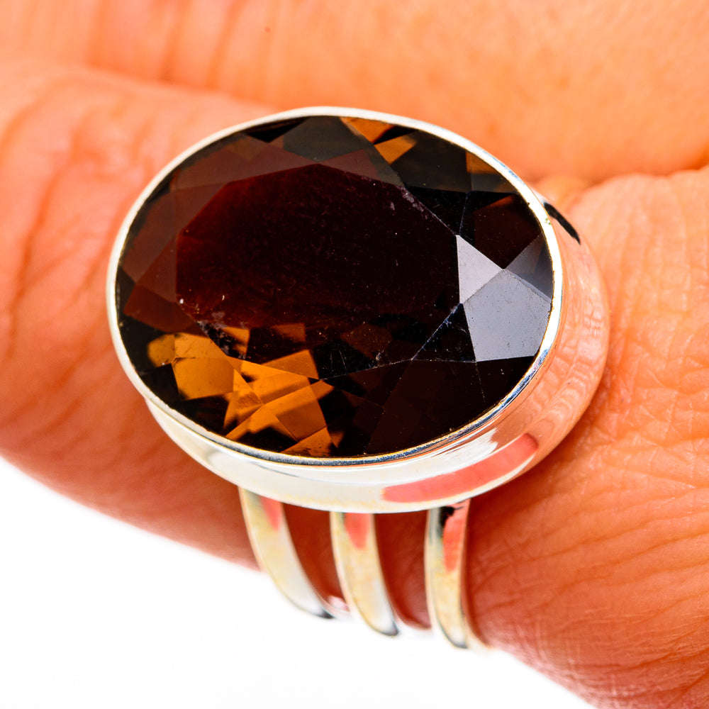 Smoky quartz ring with large oval dark brown faceted gemstone in silver bezel