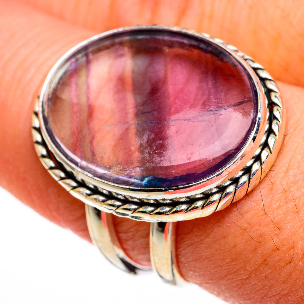 Sterling silver oval fluorite ring with braided frame and purple-pink iridescent gemstone