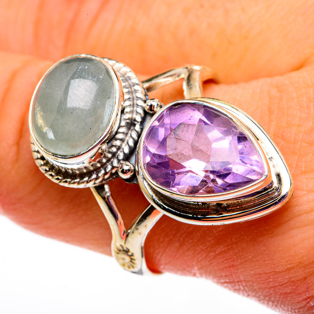 Sterling silver ring with oval aquamarine and faceted purple amethyst stones, side view