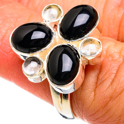 Oval black onyx cluster ring in 925 sterling silver with small clear accent stones