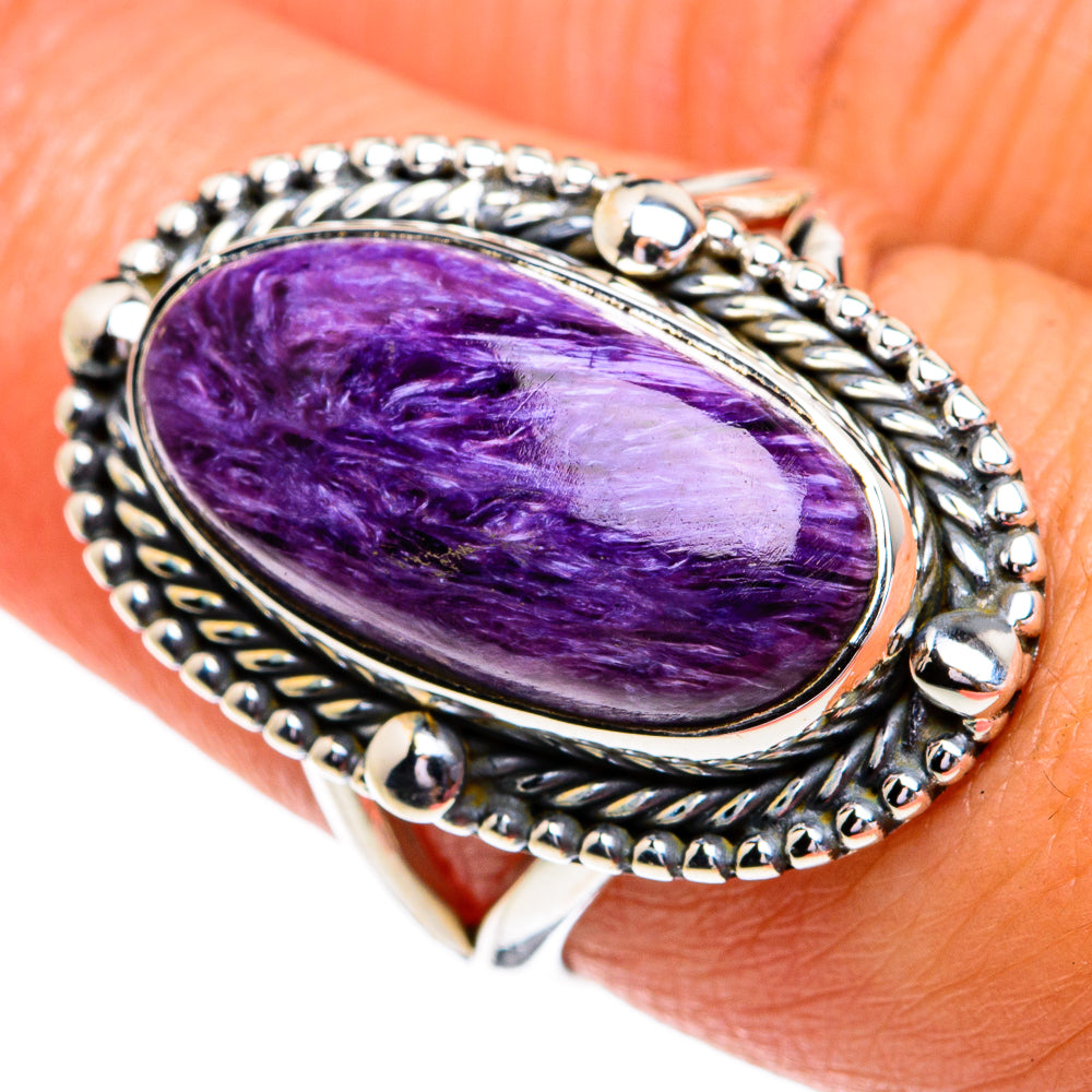 Sterling silver oval charoite ring showing purple stone in twisted beaded frame