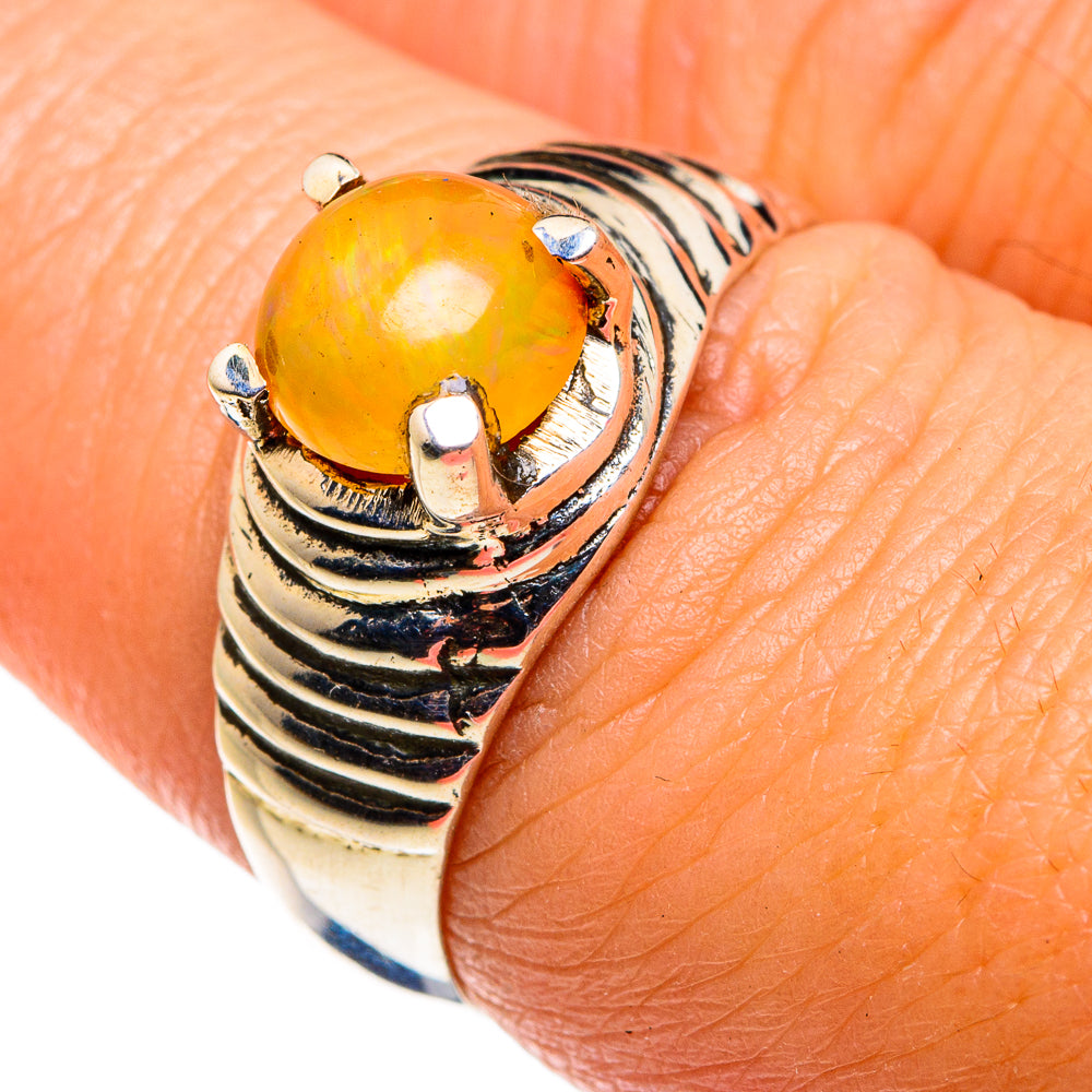 Sterling silver ring with golden oval opal and sculpted swirl band