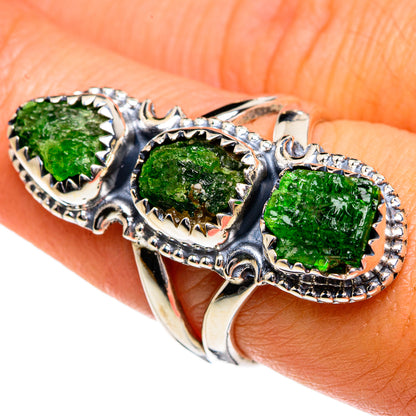 Silver ring with three rough green gemstones in ornate openwork bezels