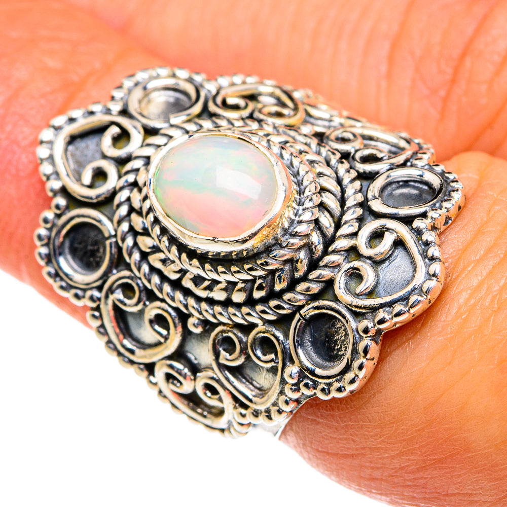 Oval opal cabochon ring, ornate silver filigree with dark round accents, size 6.5