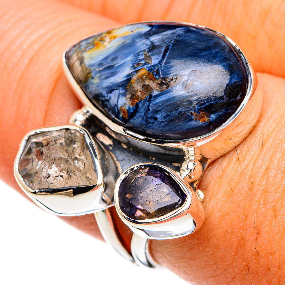 Sterling silver ring with large oval blue stone and small purple amethyst-like gem