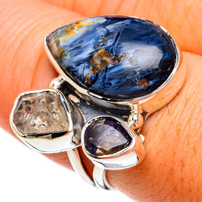 Sterling silver ring with large oval blue stone and small purple amethyst-like gem