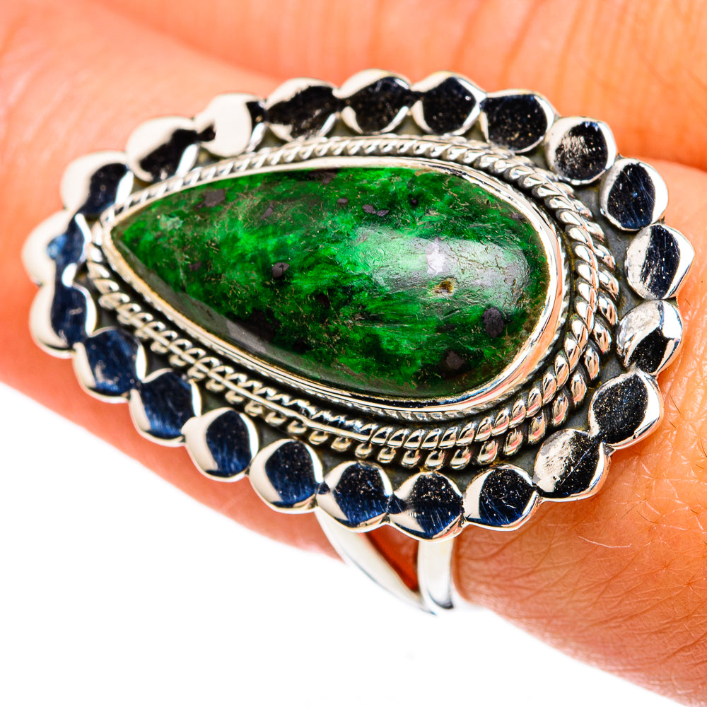 Sterling silver ring with green oval stone, rope bezel, and blue accent stones