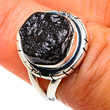 Sterling silver ring with rough black tourmaline stone set in round bezel, curved band