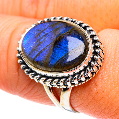 Sterling silver labradorite ring with blue oval gemstone and scalloped bezel