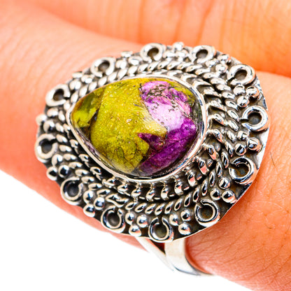 Sterling silver ring with oval yellow-green and purple cabochon, ornate halo band