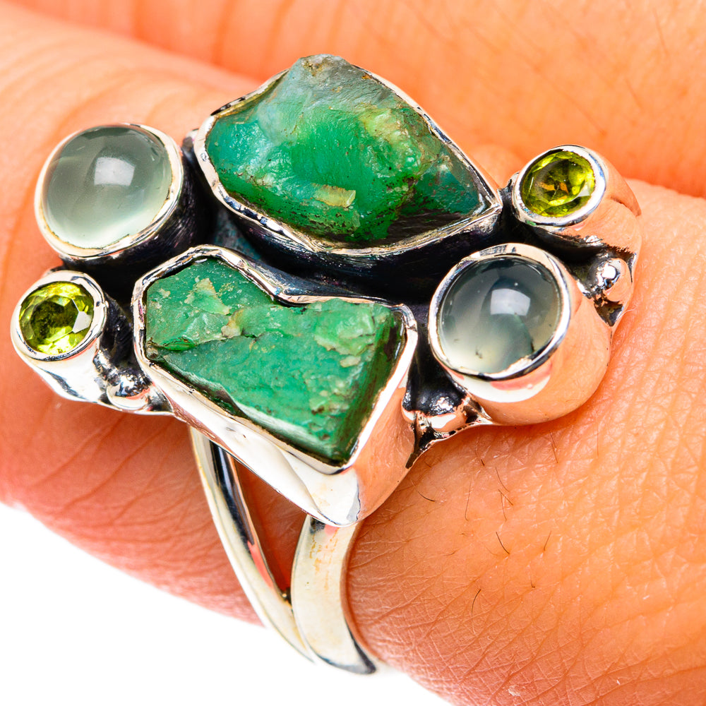 Silver ring with large rough green marquise stones and light blue round cabochons
